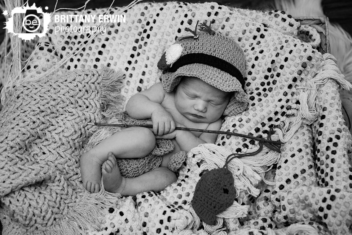Indianapolis-in-home-newborn-photographer-baby-boy-sleeping-with-fishing-hat-net-and-pole.jpg