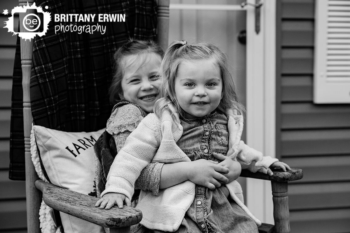Indianapolis-portrait-photographer-sisters-on-chair-porch-session.jpg