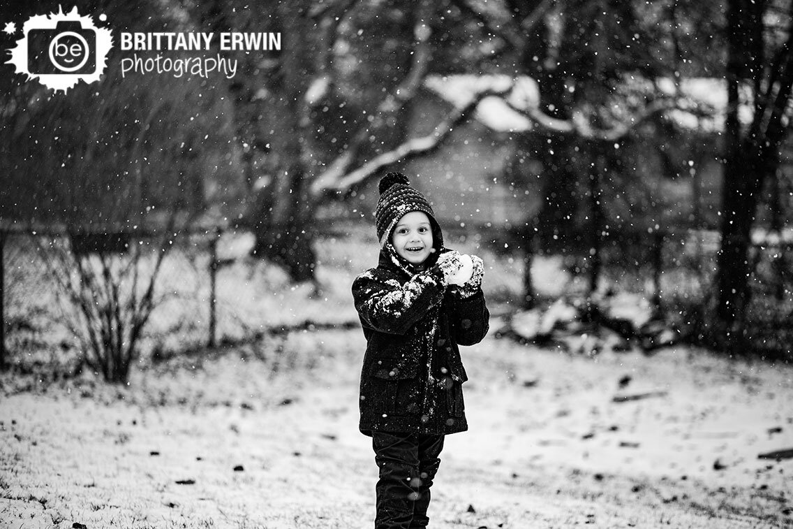 Indianapolis-portrait-photographer-boy-playing-in-snow-winter-snowing.jpg