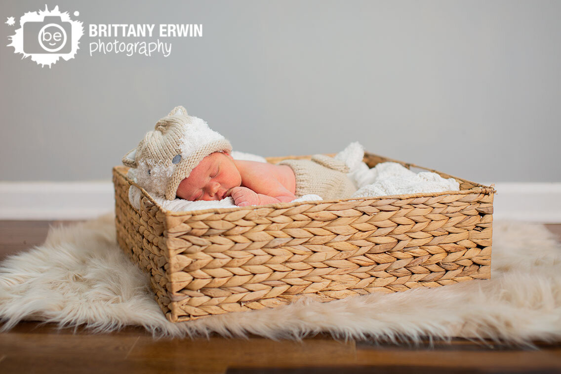 Indianapolis-lifestyle-newborn-portrait-photographer-fuzzy-blanket-basket-with-grey-wall.jpg