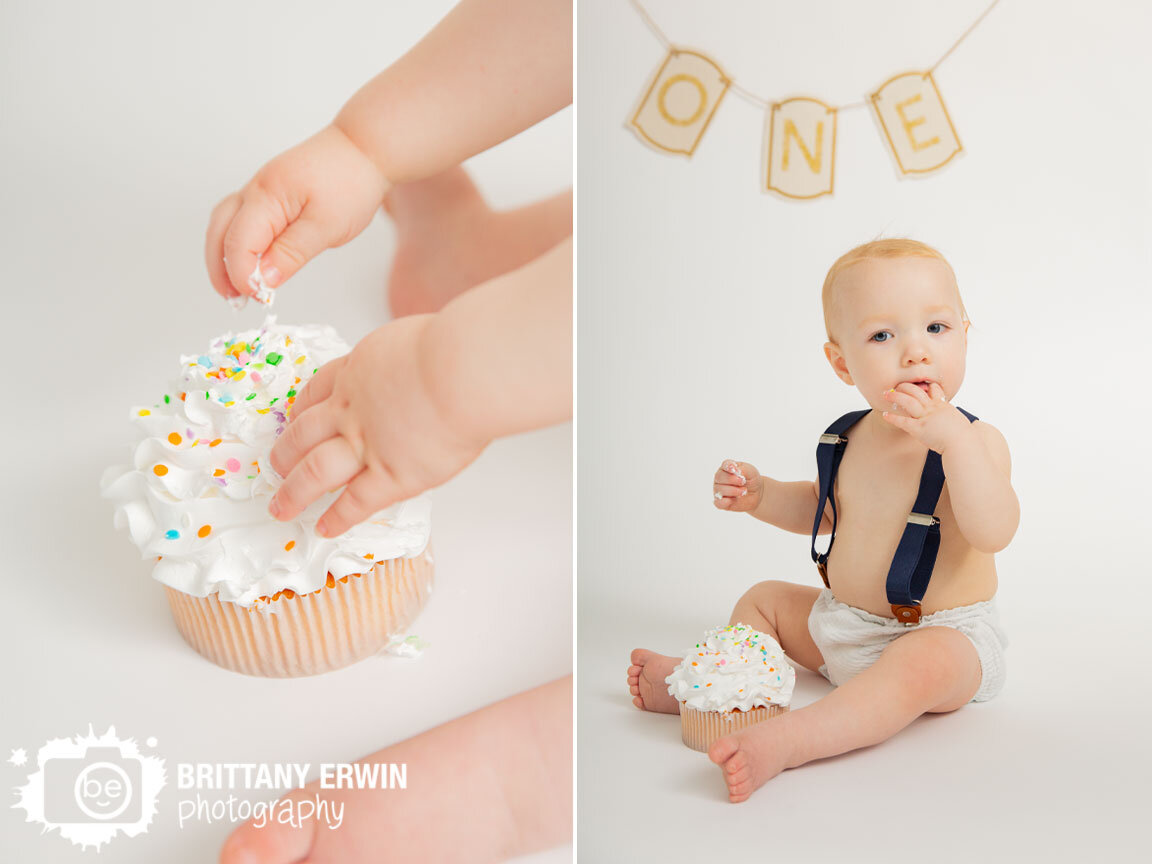 white-seamless-backdrop-one-banner-cake-smash-boy-with-suspenders.jpg