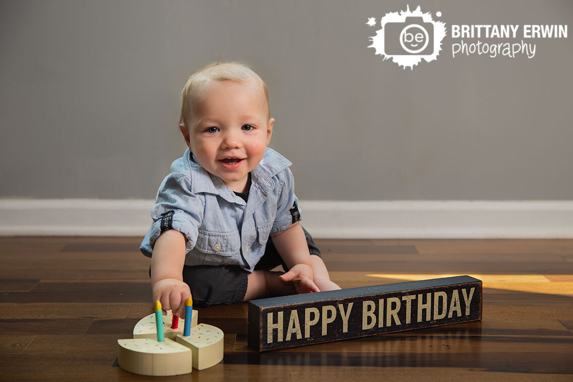 Lifestyle-birthday-portrait-photographher-happy-boy-wooden-cake-with-candles.jpg