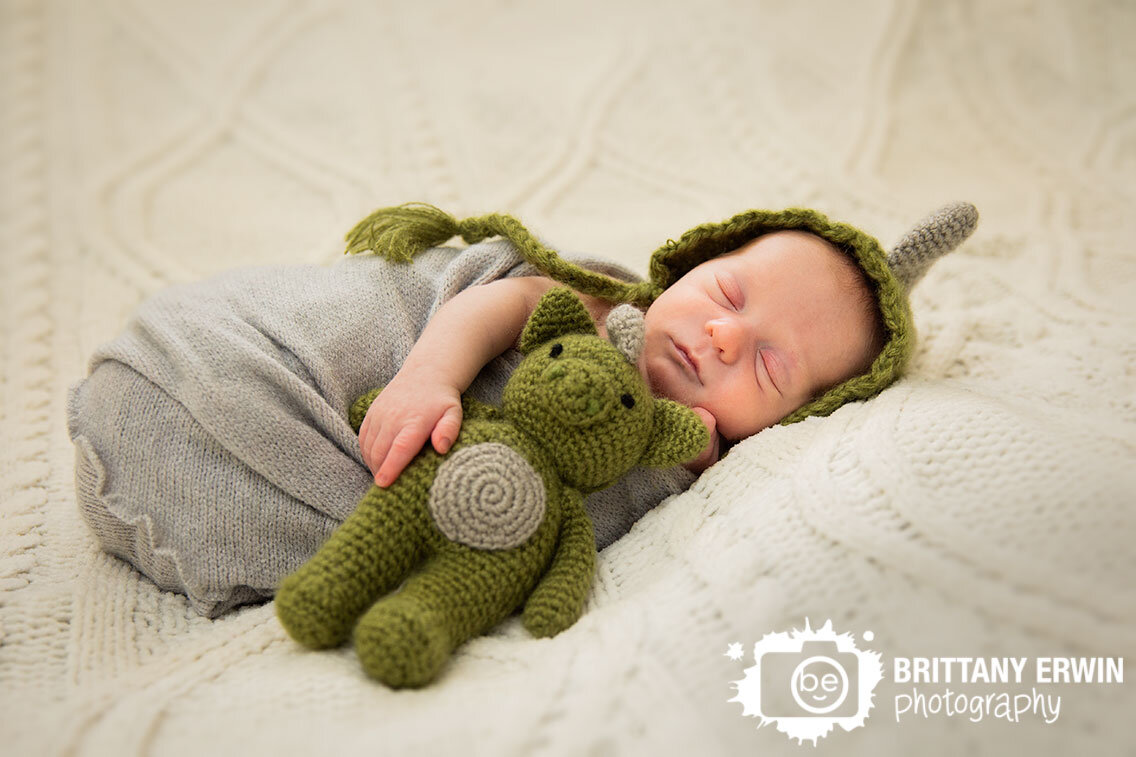 Indianapolis-lifestyle-portrait-photographer-sleeping-baby-boy-dinosaur-hat-stuffed-animal.jpg