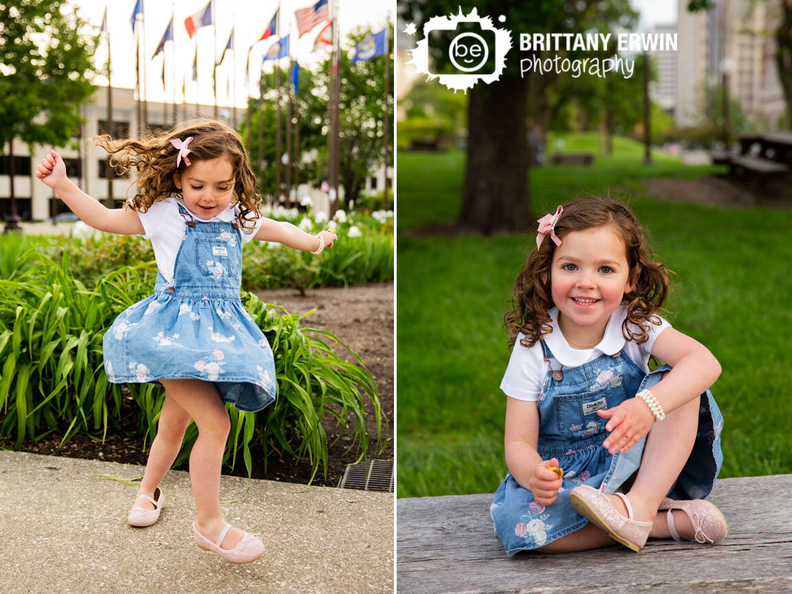 toddler-playing-downtown-Indianapolis-birthday-portrait-photographer-overall-dress.jpg