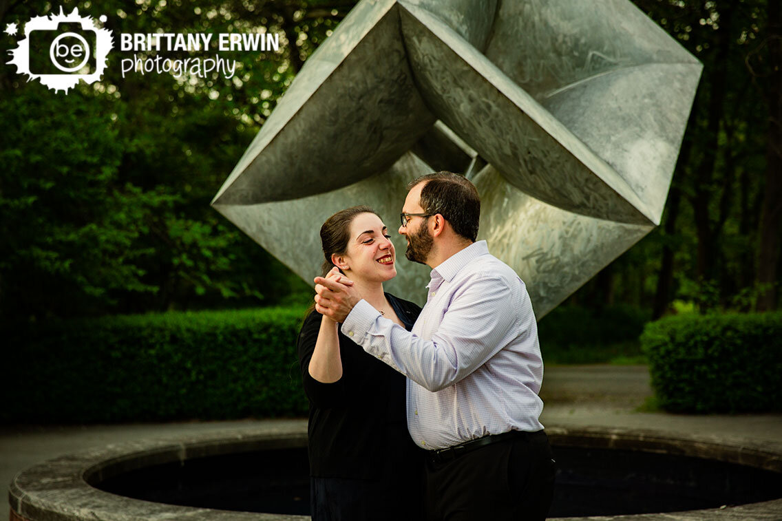 Indianapolis-Art-Center-engagement-portrait-photographer-couple-dancing-with-metal-cube-sculpture.jpg