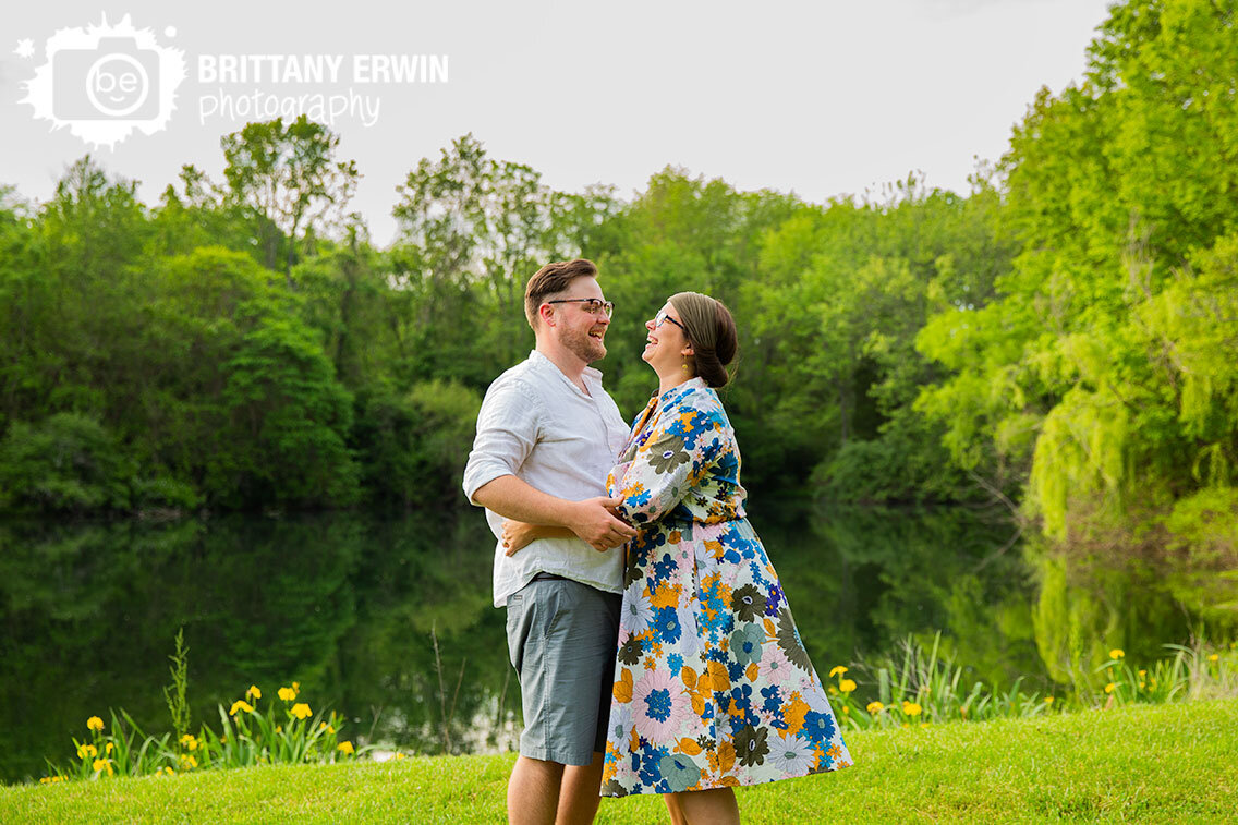 couple-laughing-dance-by-pond-summer-engagement-photographer.jpg
