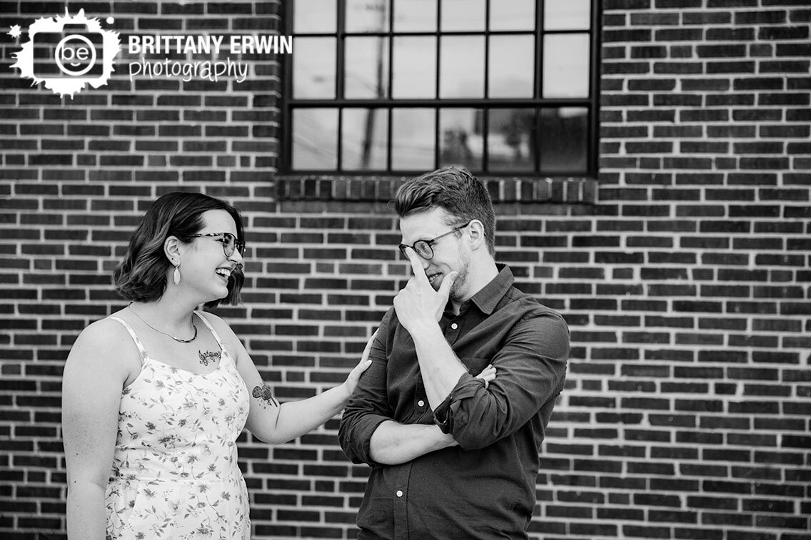 brick-wall-portrait-couple-funny-Fountain-Square-engagement-photographer.jpg