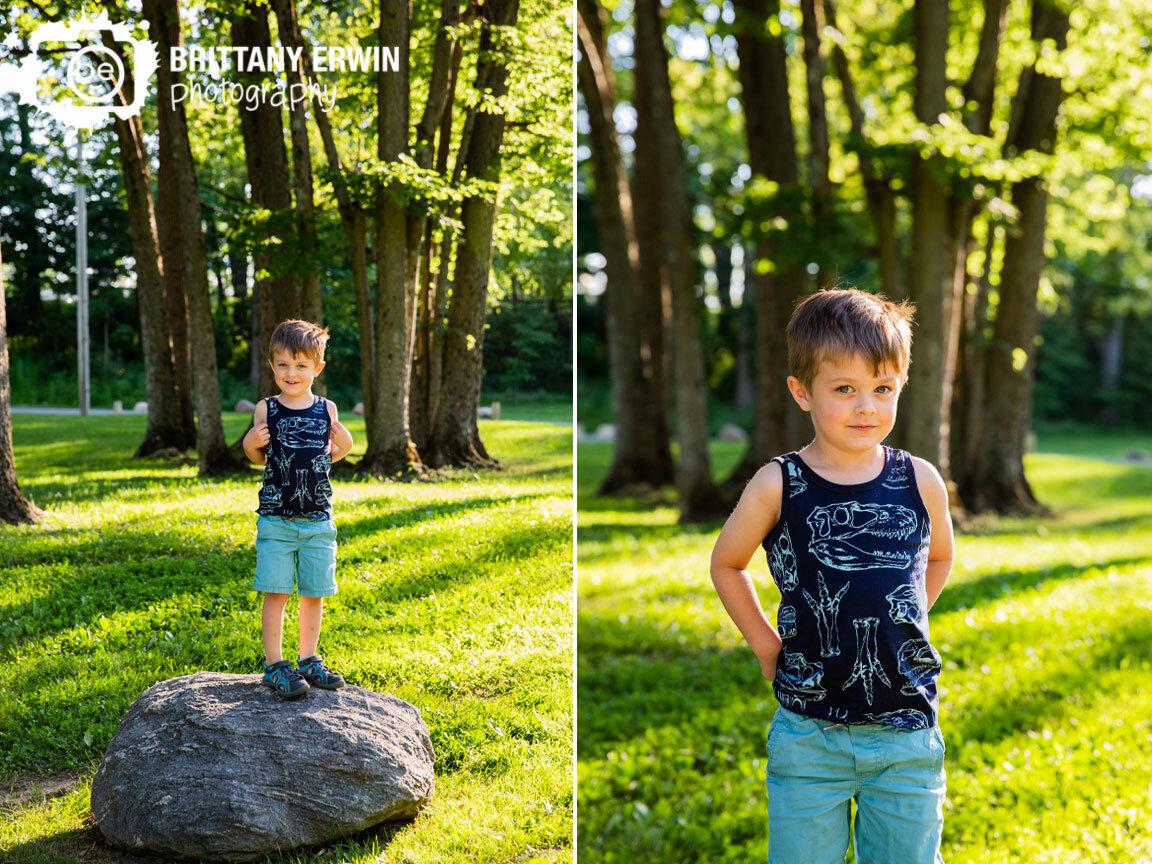 Indianapolis-boy-portrait-photographer-dinosaur-shirt-climbing-on-rocks-in-park.jpg