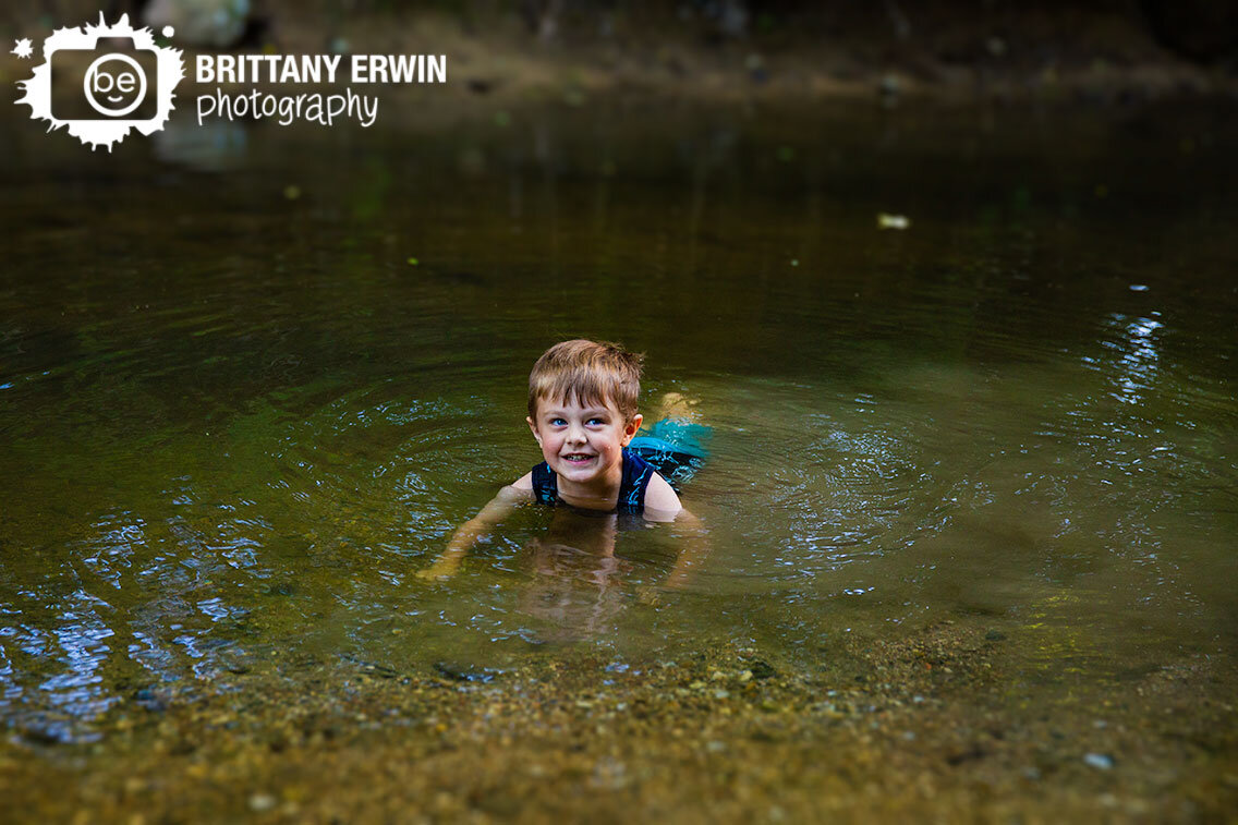 Indianapolis-creek-stomp-boy-playing-in-creek-water-swimming.jpg