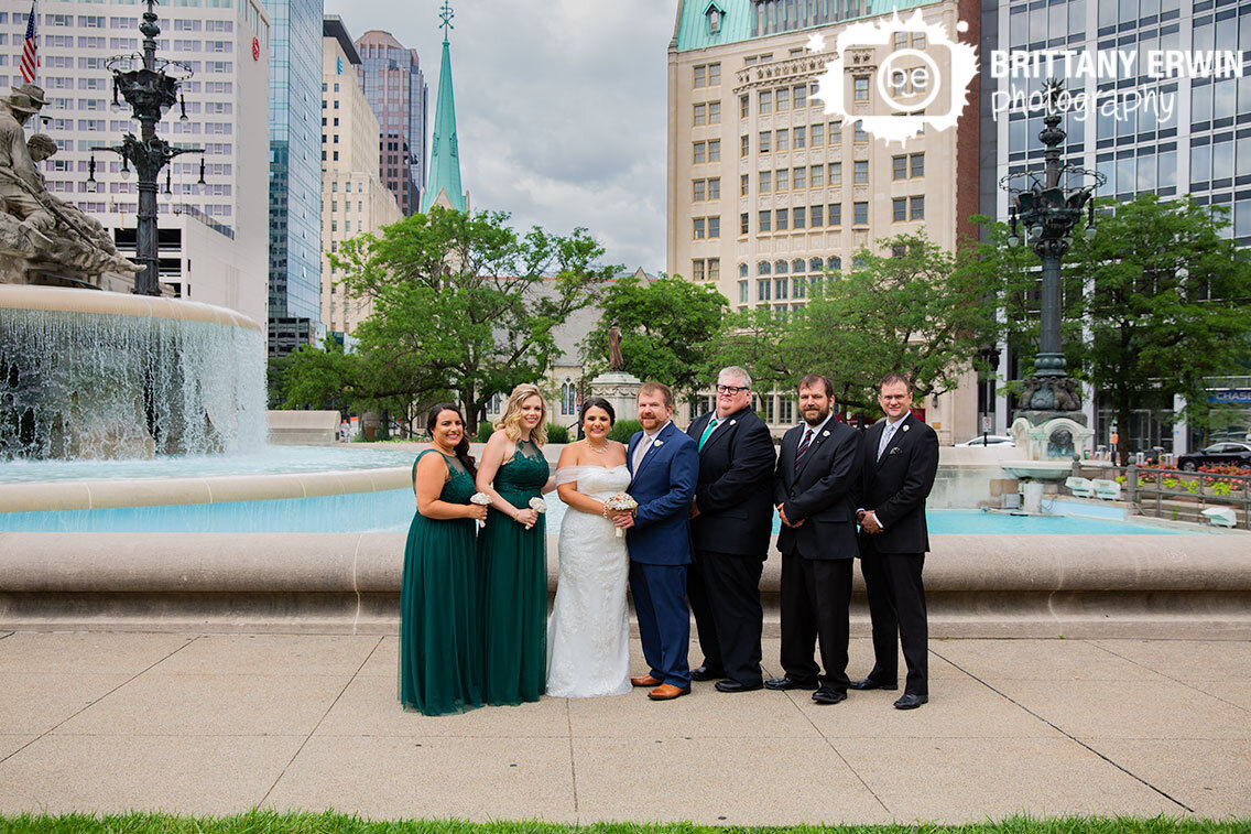 Bridal-party-portrait-group-with-fountain-at-monument-circle-summer.jpg