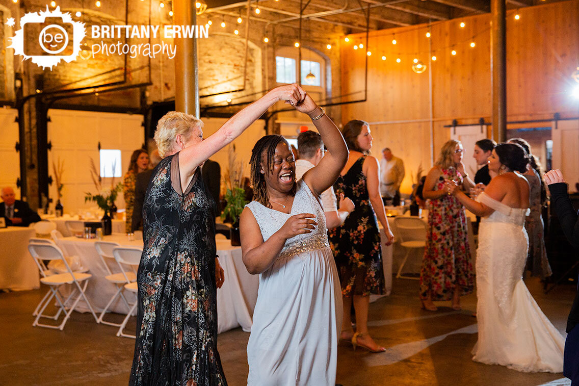Indianapolis-wedding-reception-dance-floor-photographer-guests-having-fun-dancing-twirl.jpg