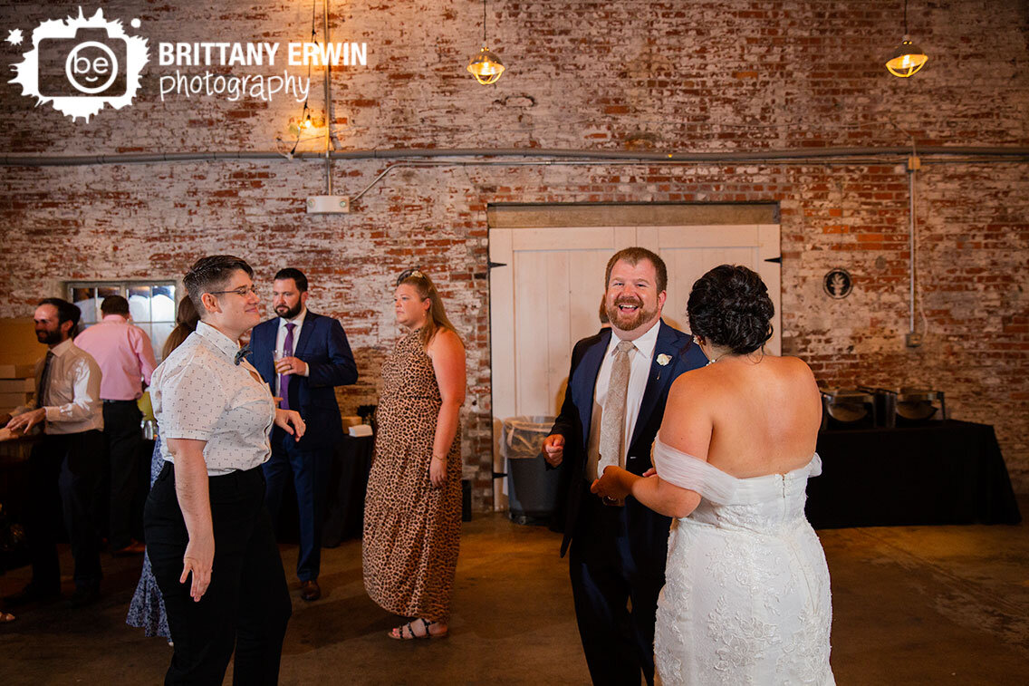 Indianapolis-wedding-photographer-groom-laughing-at-reception.jpg