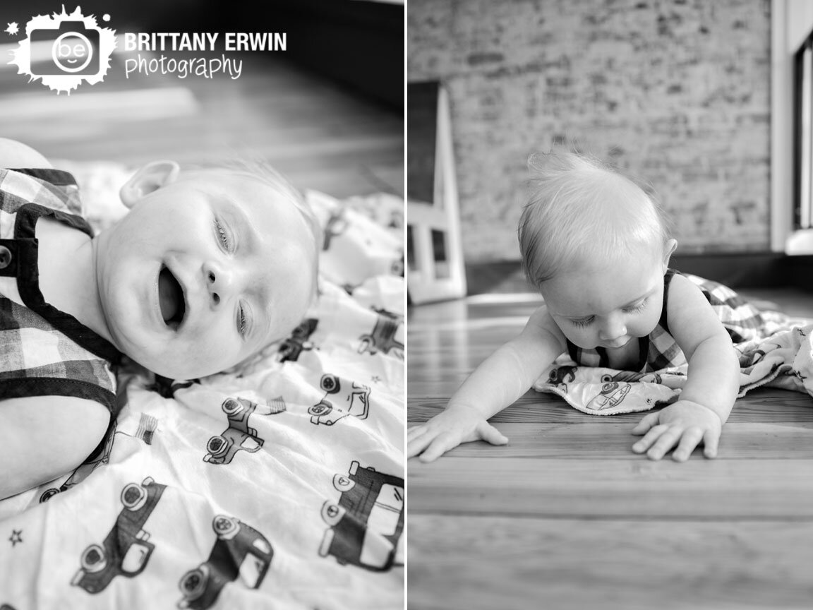 baby-boy-playing-on-truck-blanket-brick-wall-milestone-portrait-photographer.jpg
