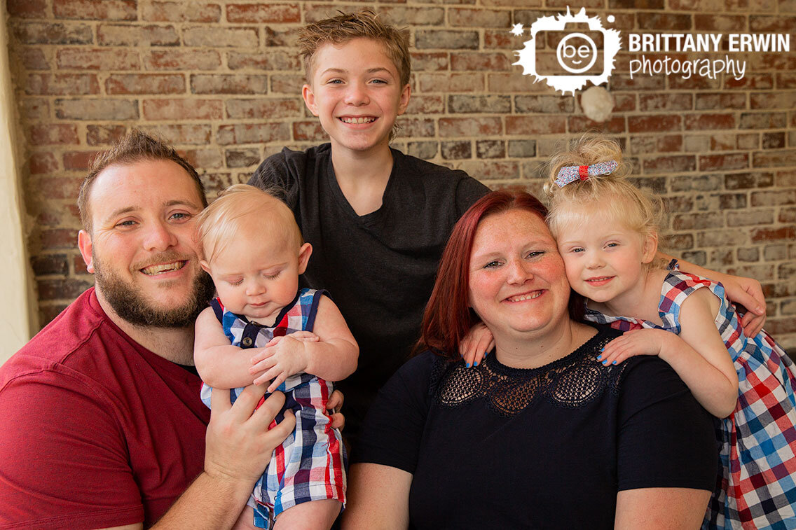 Indianapolis-family-portrait-photographer-baby-boy-big-sister-brother-with-parents-brick-wall.jpg
