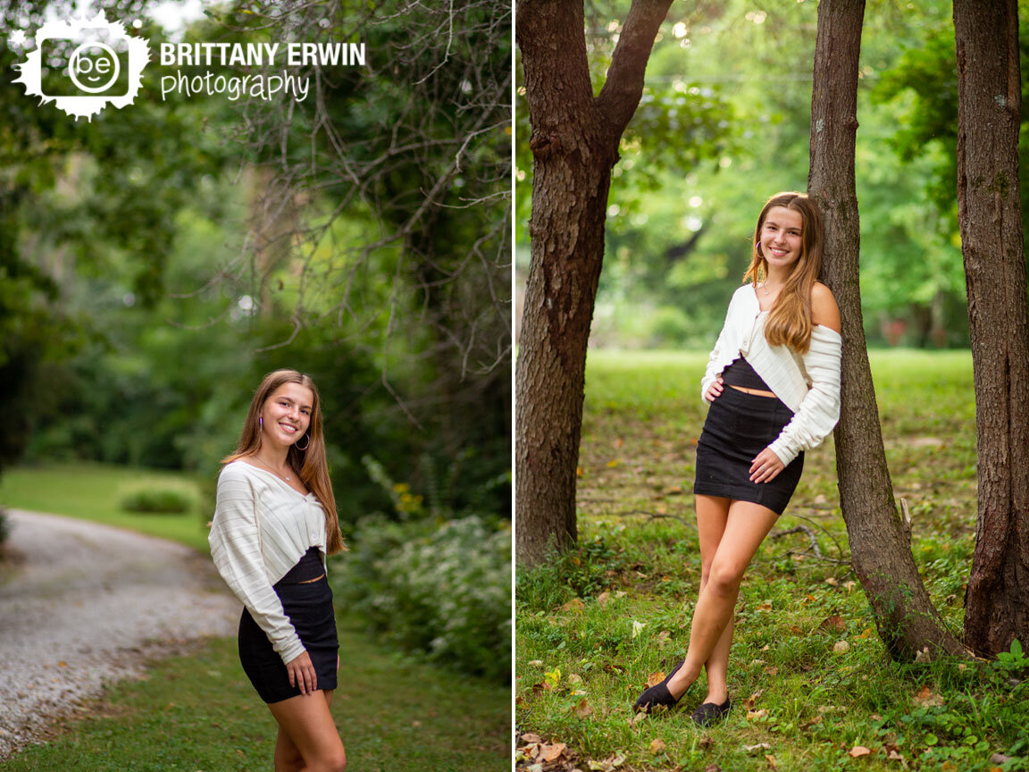 Senior-portrait-photographer-outdoor-session-in-nature-gravel-path-girl-leaning-on-tree.jpg