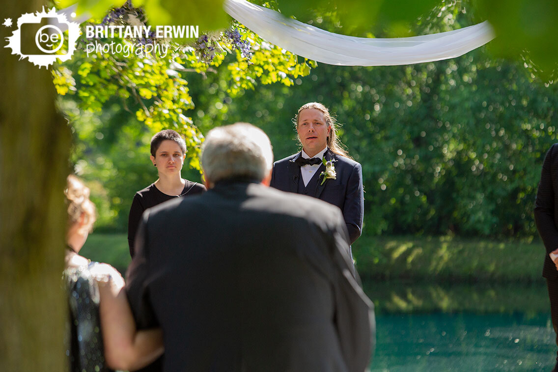 Indianapolis-wedding-photographer-groom-reaction-as-bride-walks-down-aisle.jpg