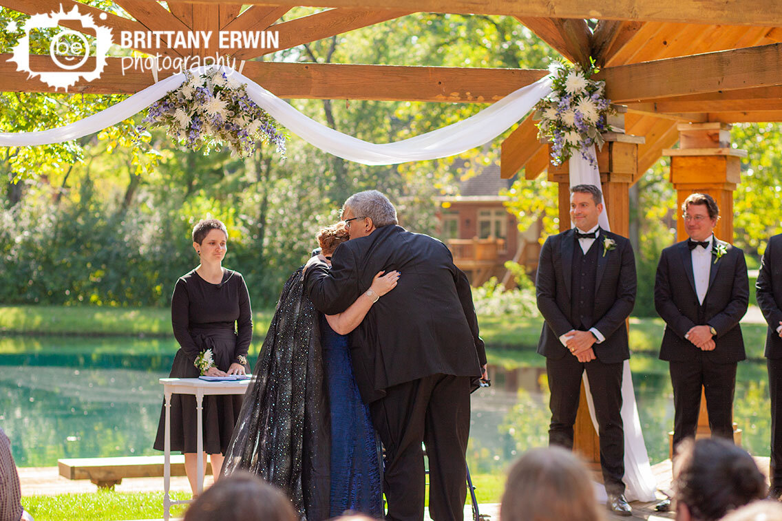 Indianapolis-outdoor-wedding-ceremony-bride-at-altar-walked-down-by-uncle.jpg