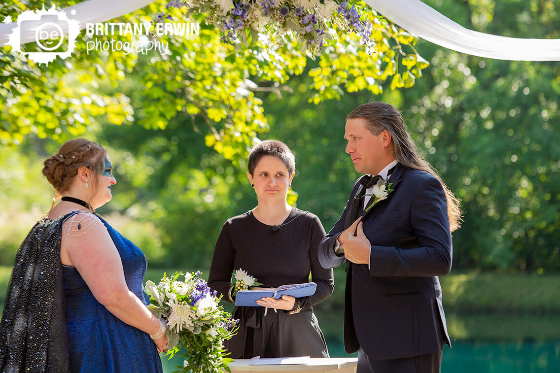 groom-after-reading-vows-at-outdoor-wedding-ceremony.jpg