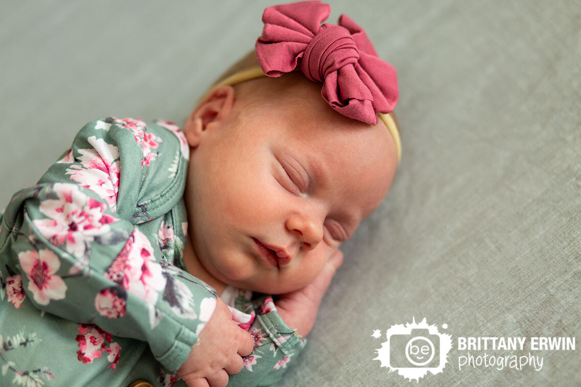 Indianapolis-newborn-portrait-photographer-baby-girl-sleeping-in-crib-with-floral-onesie.jpg