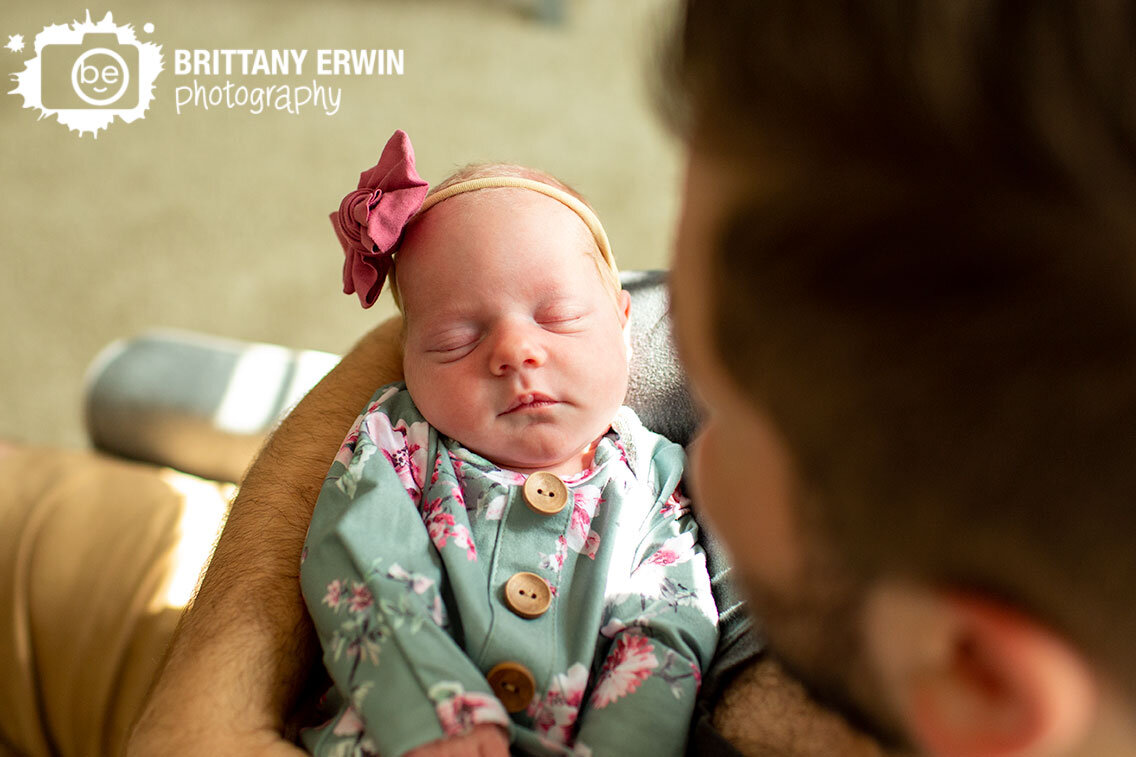 Indianapolis-in-home-lifestyle-newborn-photographer-father-holding-baby-girl.jpg