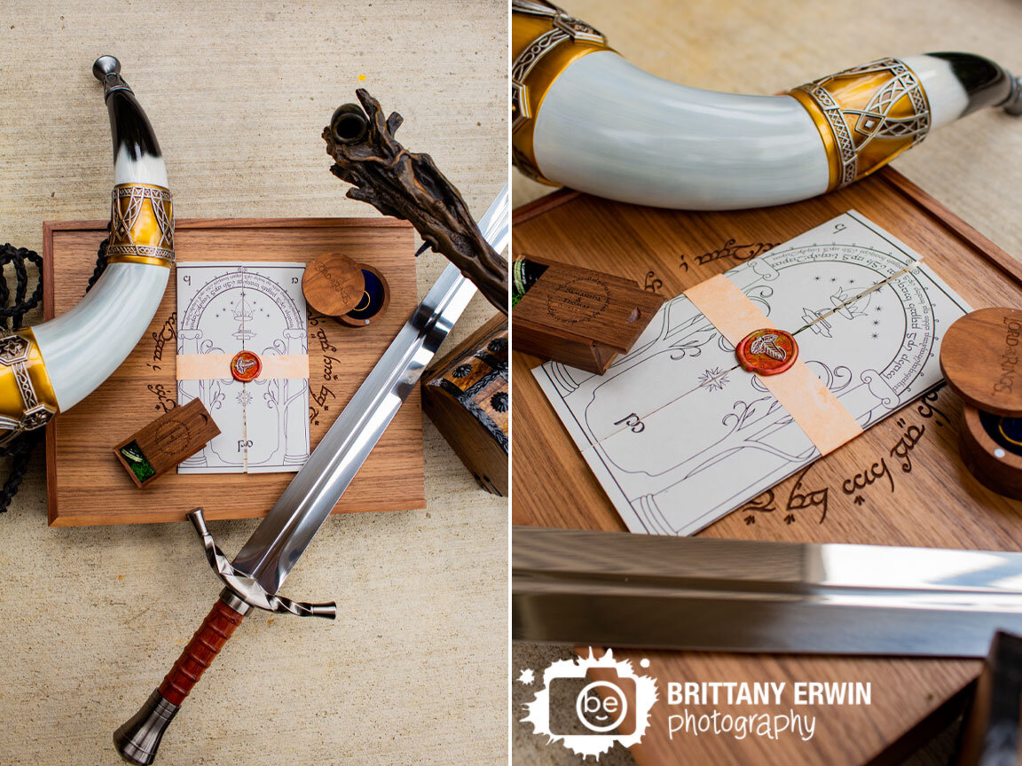 Lord-of-the-rings-themed-wedding-details-invitation-ring-box-custom-scroll-with-sword-and-horn.jpg