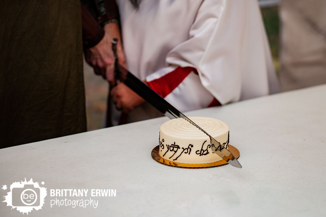 lord-of-the-rings-the-one-ring-themed-wedding-cake-cutting-with-sword.jpg