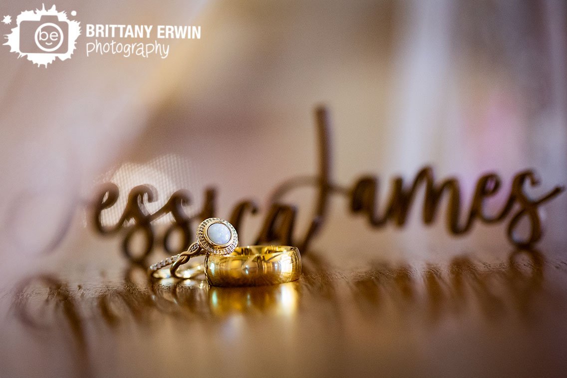 Indianapolis-wedding-photographer-rings-with-custom-laser-cut-wood-names-under-veil.jpg