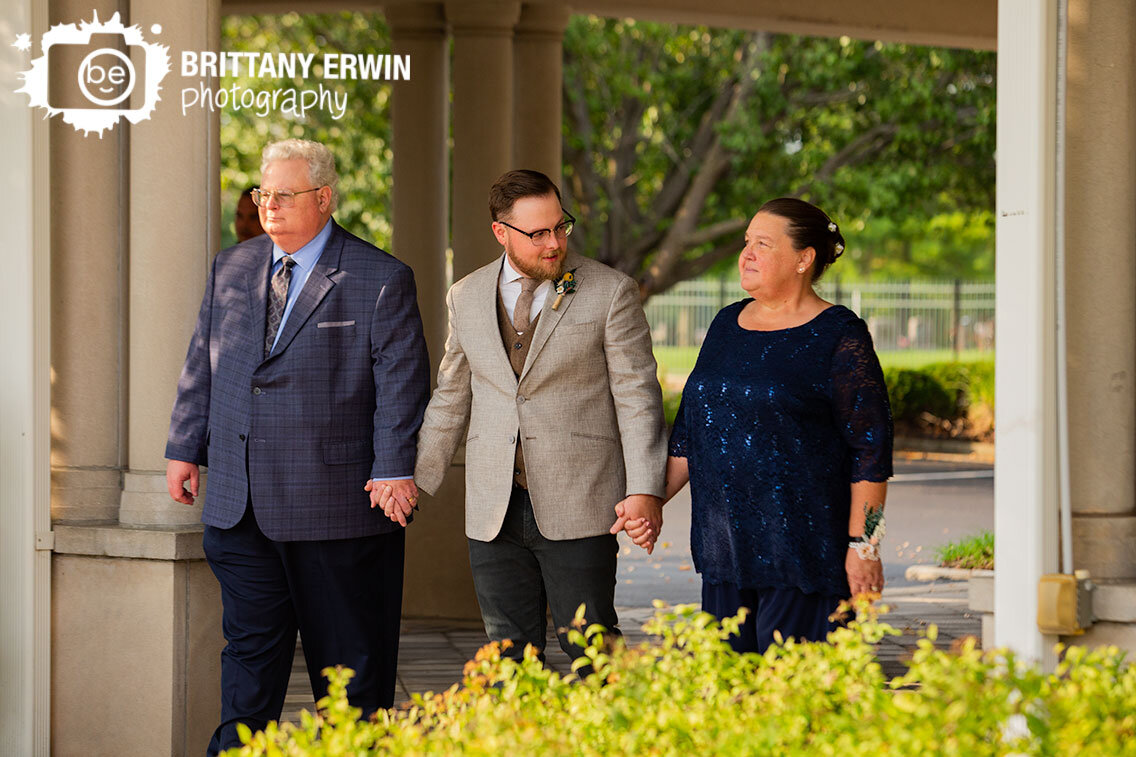 groom-with-parents-at-outdoor-wedding-ceremony-at-Community-Life-Center-Indianapolis.jpg
