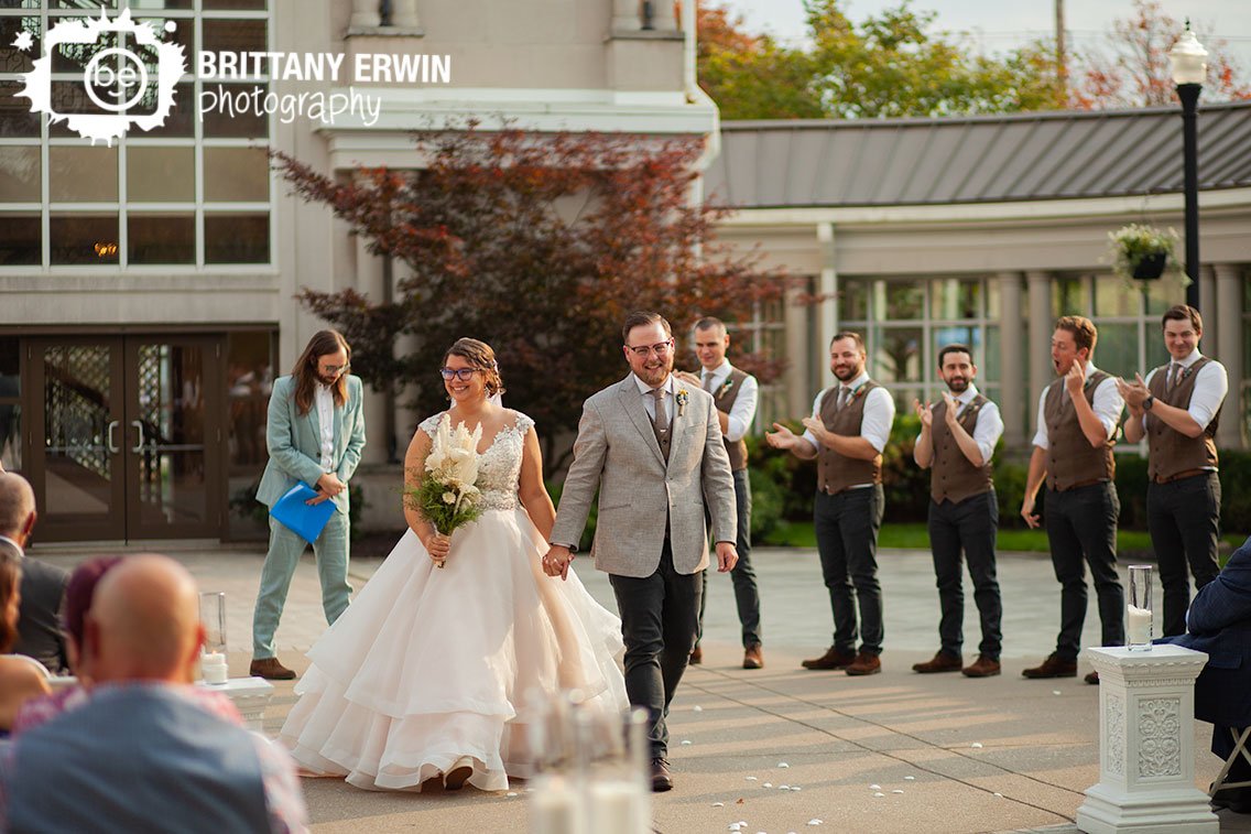 Indianapolis-wedding-ceremony-photographer-couple-walking-down-aisle-together.jpg