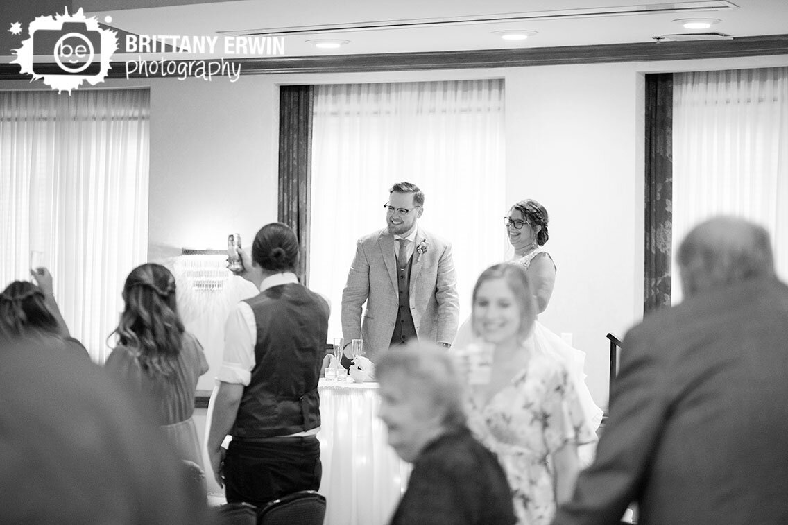 Indianapolis-wedding-photographer-couple-at-sweetheart-table-reaction.jpg