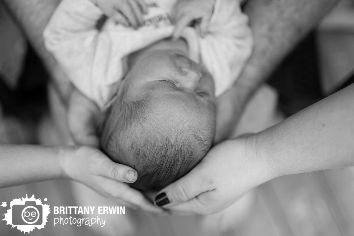 newborn-portrait-photographer-family-holding-baby-boy.jpg