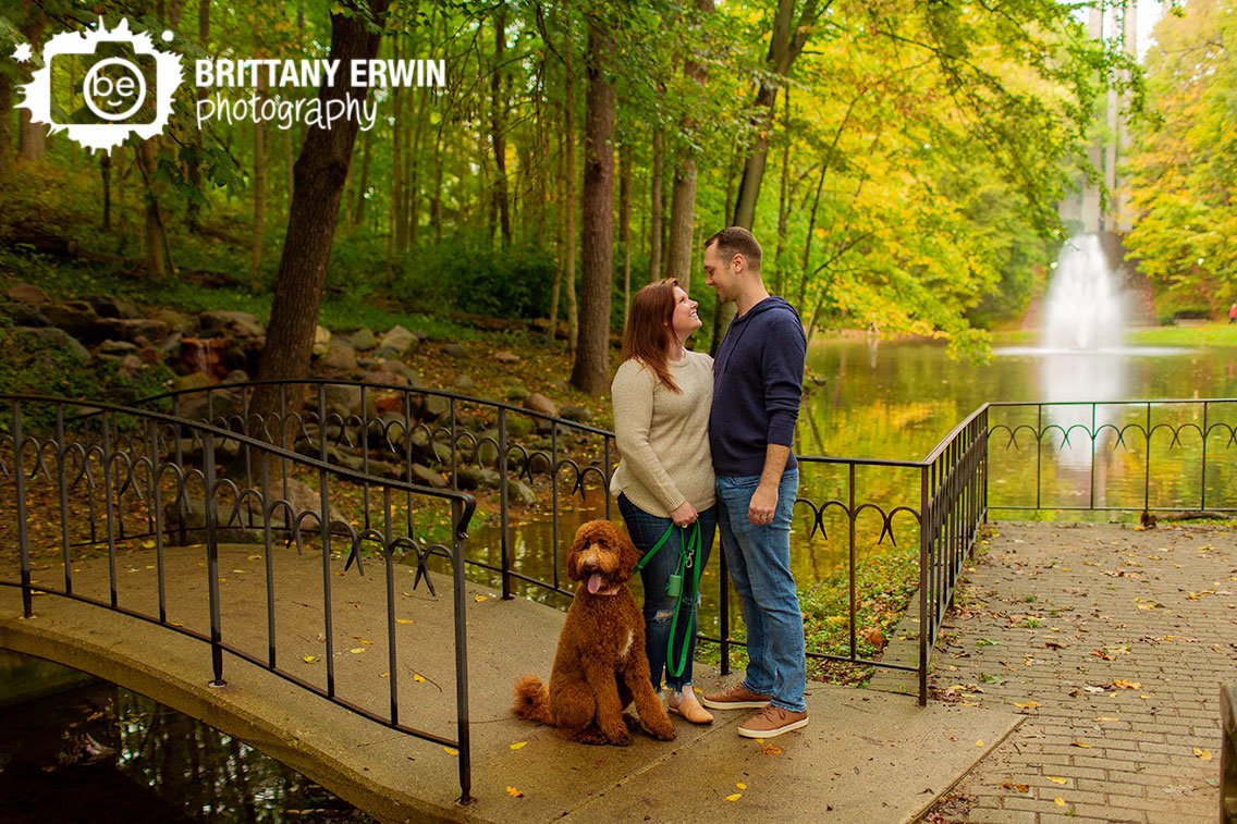 Indianapolis-outdoor-fall-portrait-photographer-couple-with-pet-dogg-by-fountain-bridge.jpg