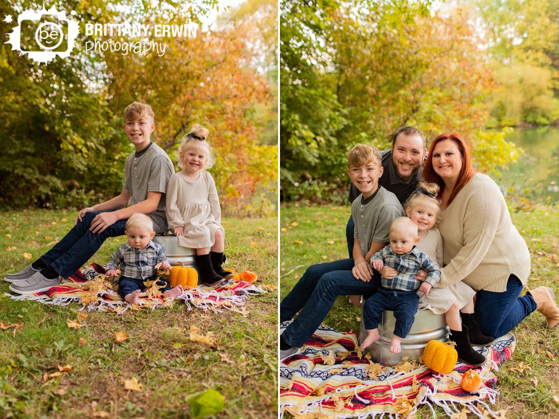 Indianapolis-fall-family-portrait-photographer-siblings-on-blanket-and-bucket-fall-pond-side-session.jpg