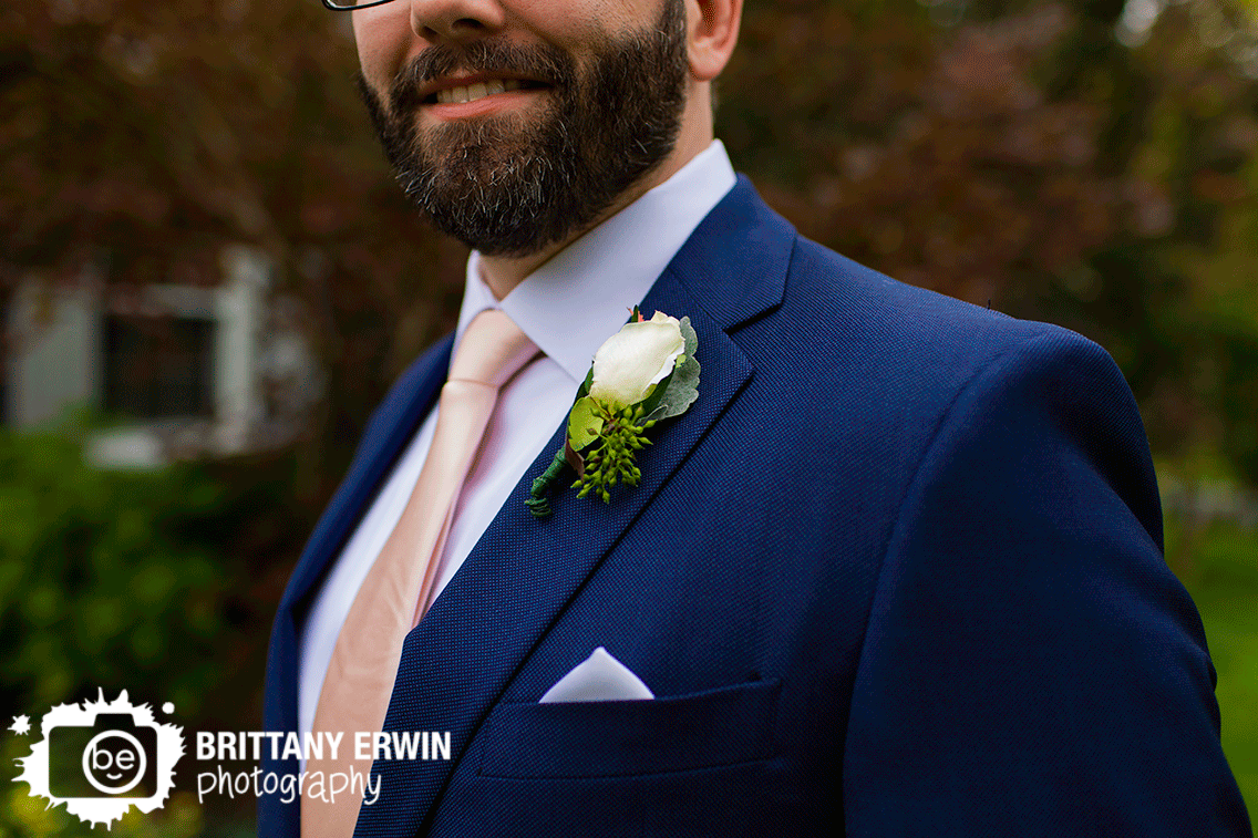 groom-boutonniere-navy-suit-blush-tie.gif
