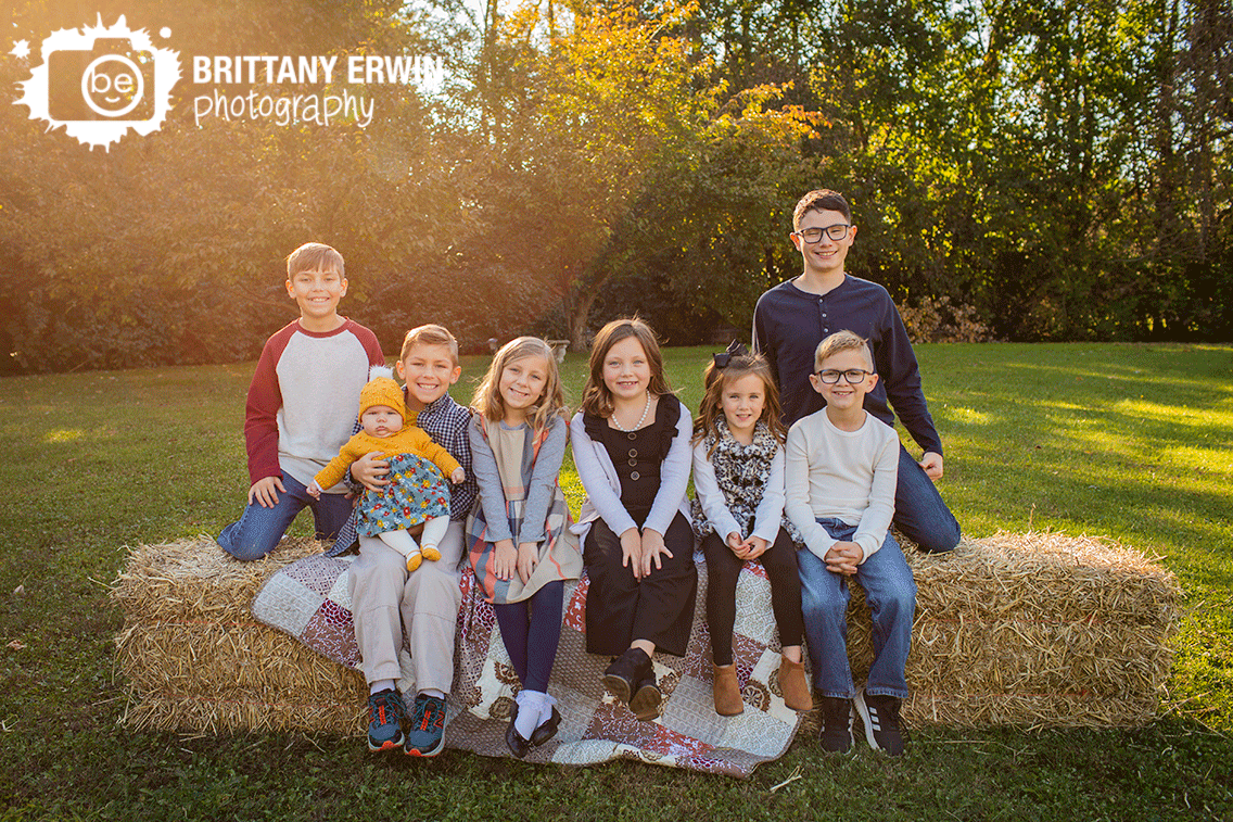 family-group-counsins-outside-fall-group-on-hay-bales.gif