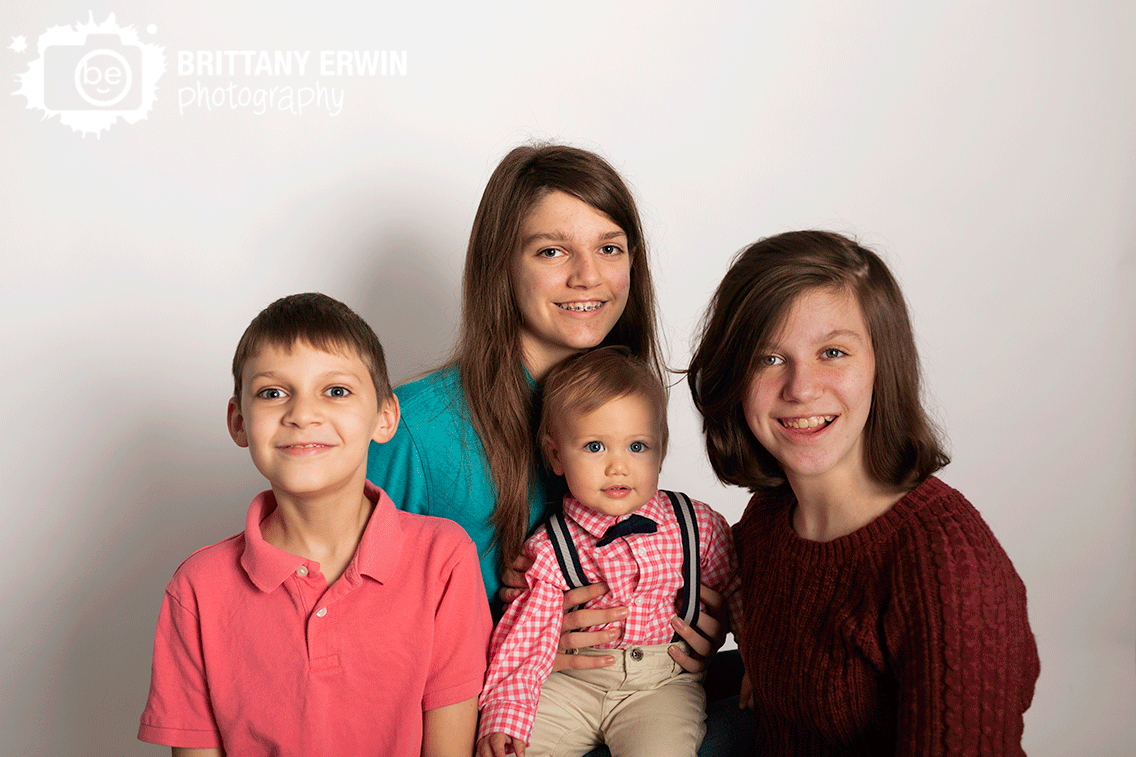 siblings-portrait-on-white-seamless-backdrop.gif