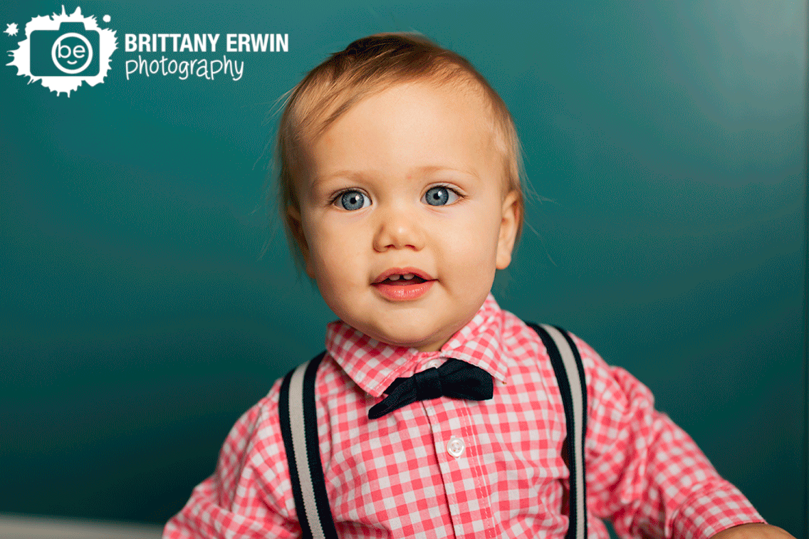 First-birthday-portrait-photographer-teal-backdrop-with-pink-plaid-shirt.gif