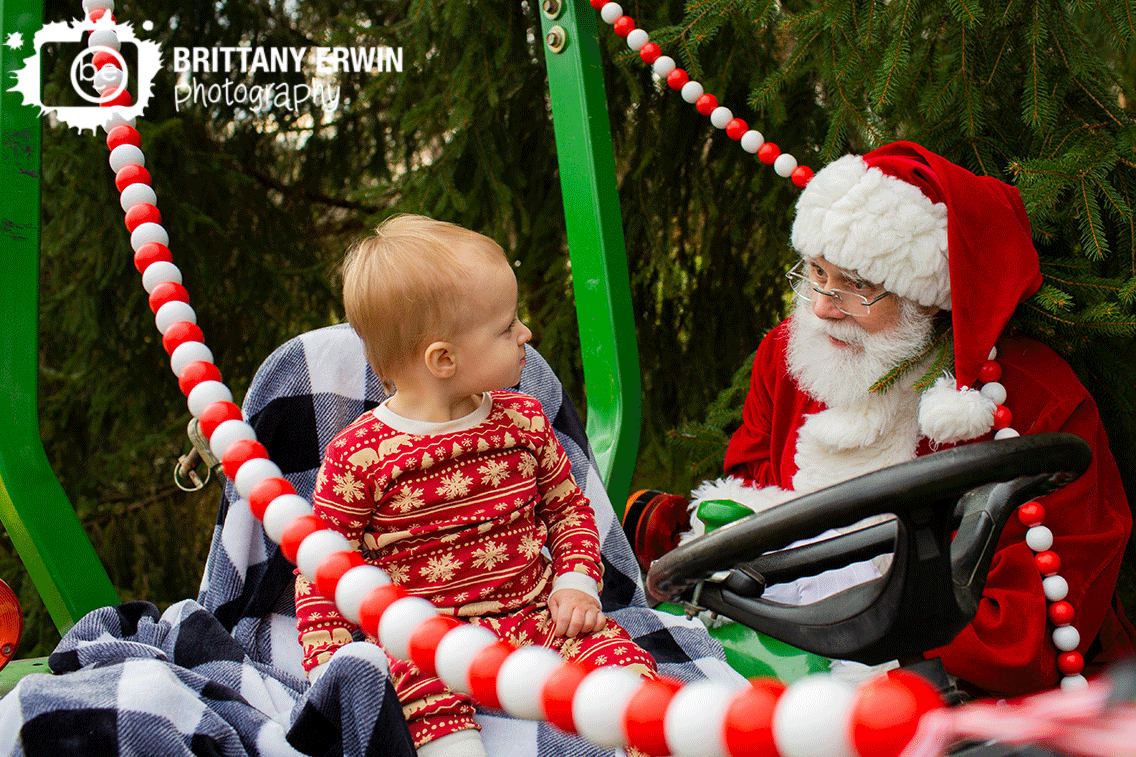 Indianapolis-Christmas-mini-session-boy-on-tractor-with-Santa.gif