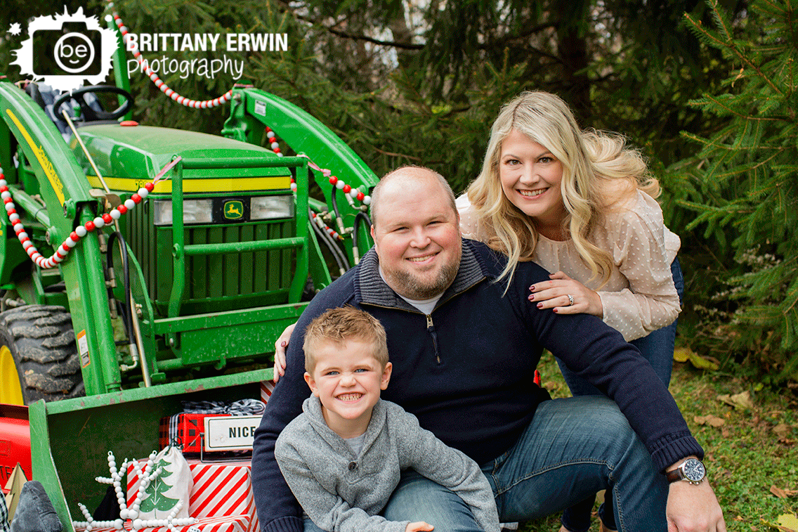 Indianapolis-Christmas-family-portrait-outside-with-tractor-wrapped-presents.gif