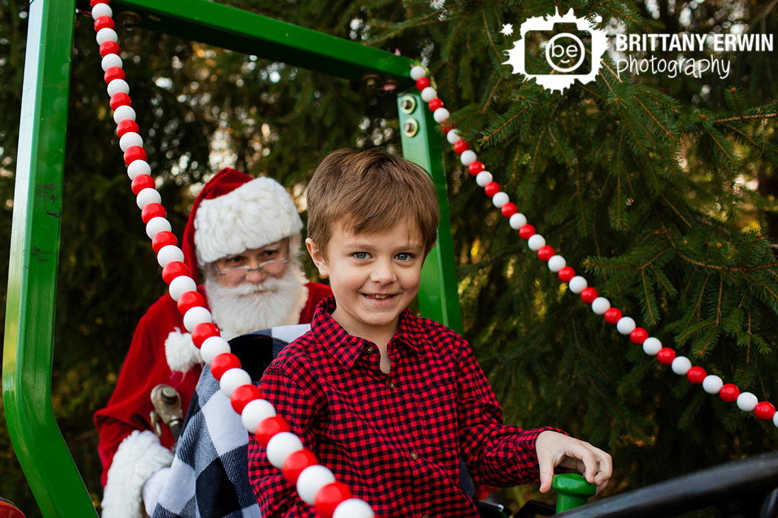 Indianapolis-boy-on-tractor-decorated-for-Christmas-mini-session-with-Santa.gif