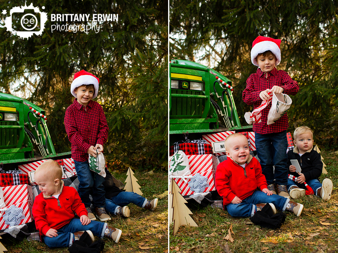 Indianapolis-Christmas-mini-session-photographer-brothers-outside-with-presents.gif