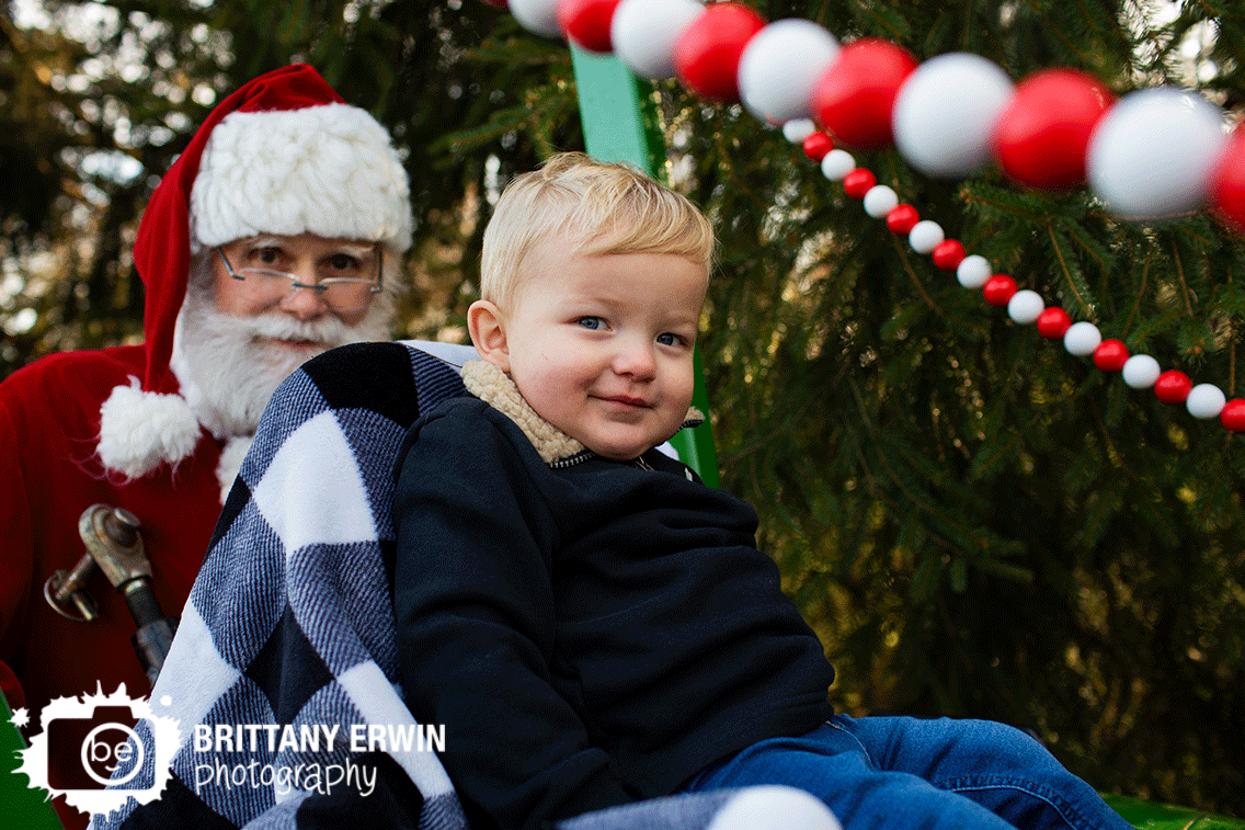 Indianapolis-christmas-portrait-photographer-boy-on-tractor-with-santa.gif
