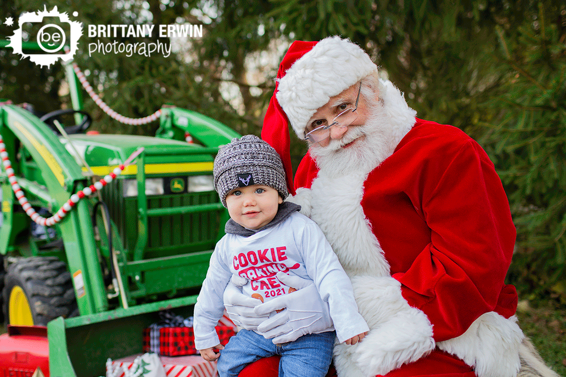 Indianapolis-Christmas-portrait-boy-with-santa-outside-tractor-with-presents.gif