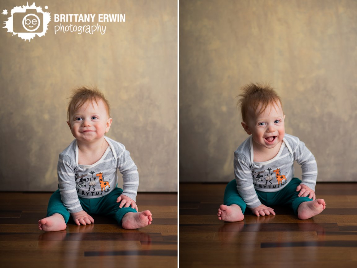 Indianapolis-portrait-photographer-milestone-boy-with-canvas-backdrop-wood-floor-sitting-happy-baby.jpg