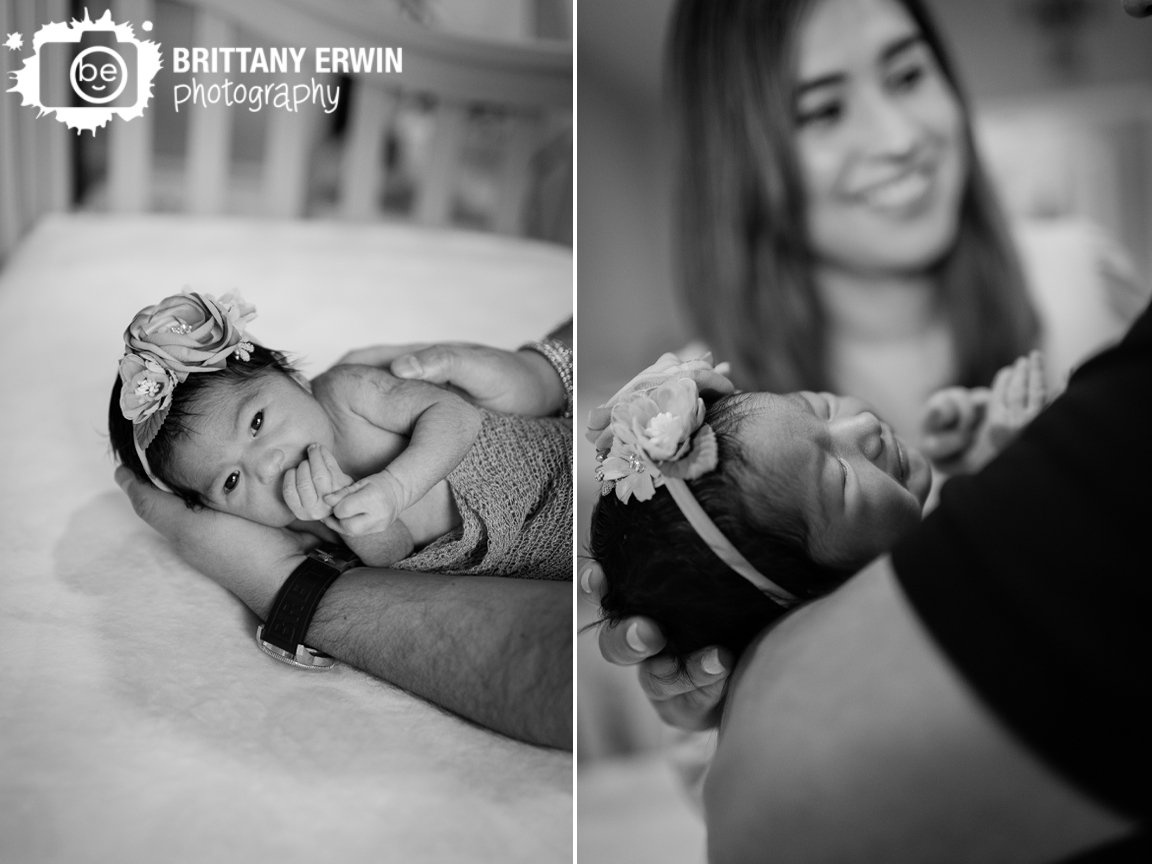 Indianapolis-portrait-photographer-newborn-baby-girl-in-crib-father-holding.jpg