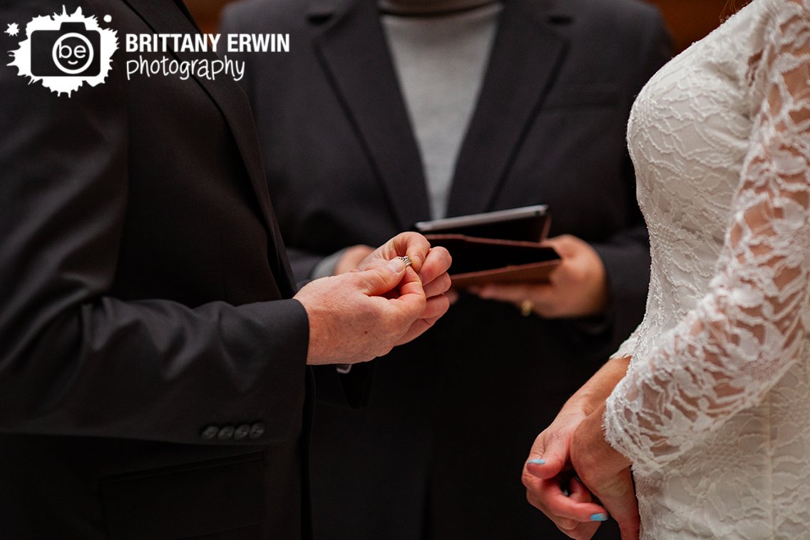 Indianapolis-downtown-elopement-photographer-couple-exchange-rings-at-ceremony.jpg