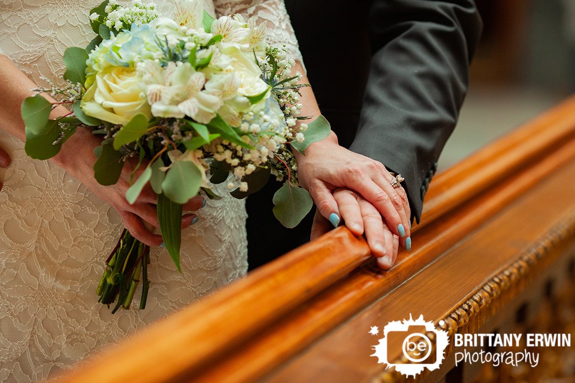 Indianapolis-elopement-photographer-couple-at-railing-with-rings-bouquet.jpg