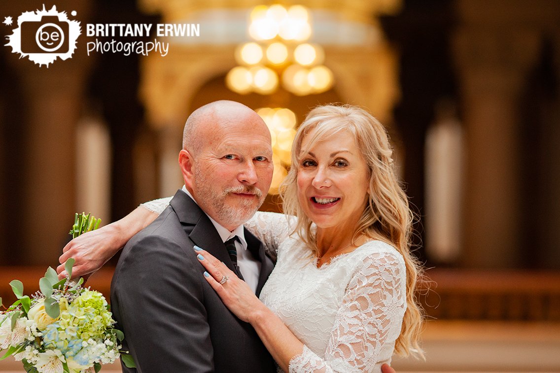 downtown-Indianapolis-elopement-photographer-bouquet-with-greenry-roses-lace-sleeve-dress.jpg