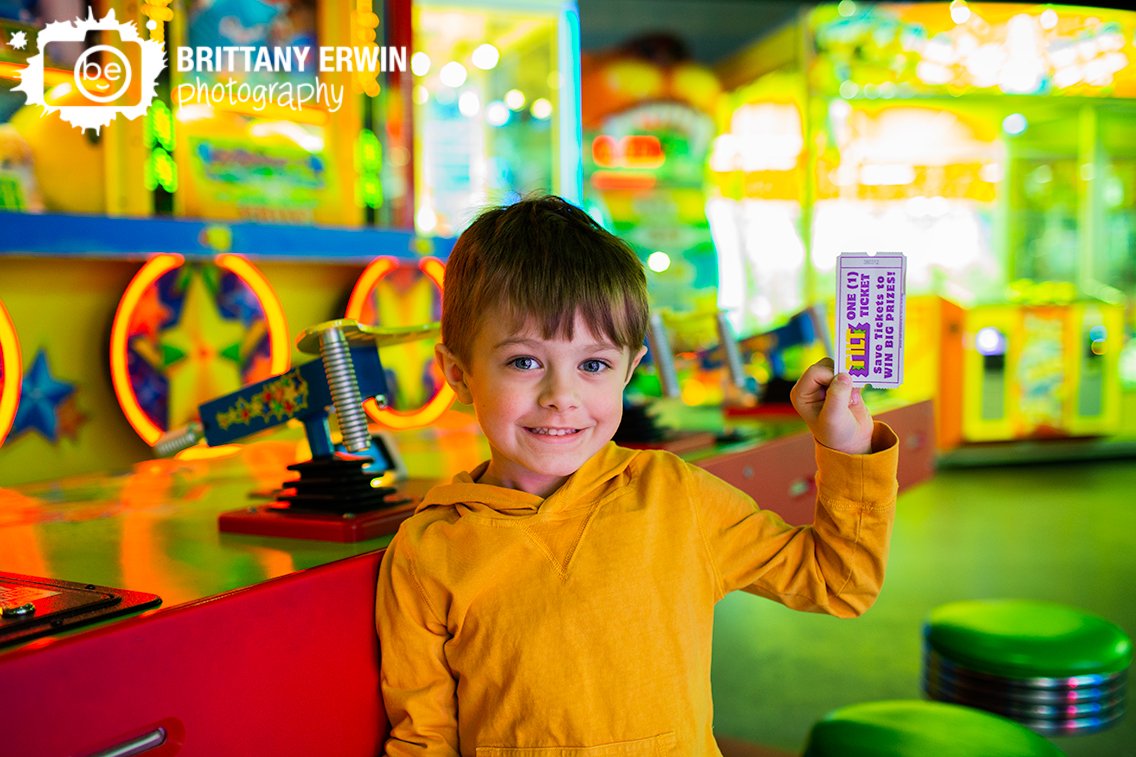 Carnival-style-game-at-arcade-in-Indianapolis-boy-with-winning-ticket.jpg
