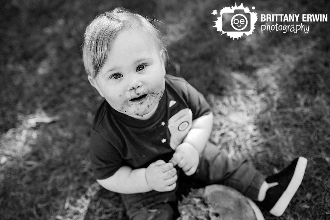 Indianapolis-portrait-photographer-baby-boy-looking-at-camera-at-cake-smash.jpg
